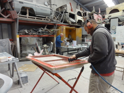 man working on fiberglass panel